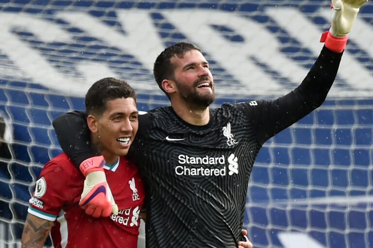 Roberto Firmino and Alisson Becker